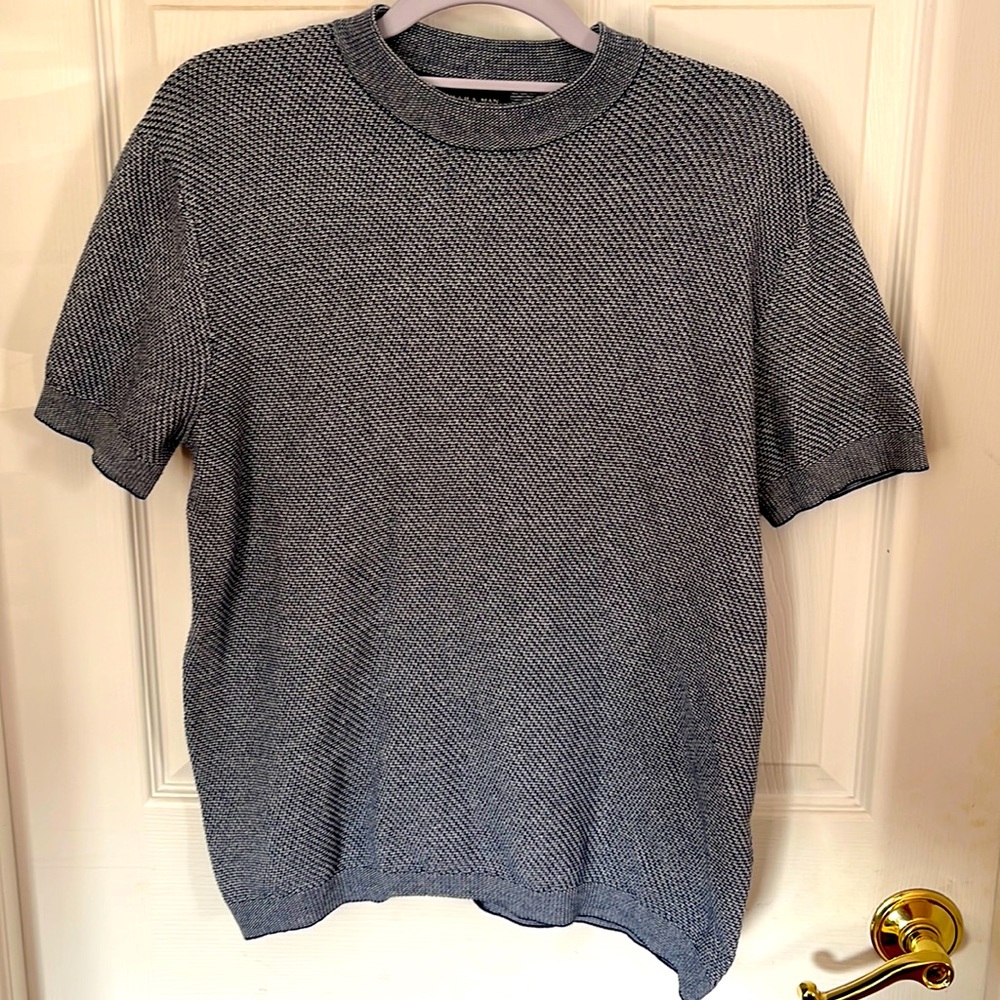 Textured pullover knit shirt.